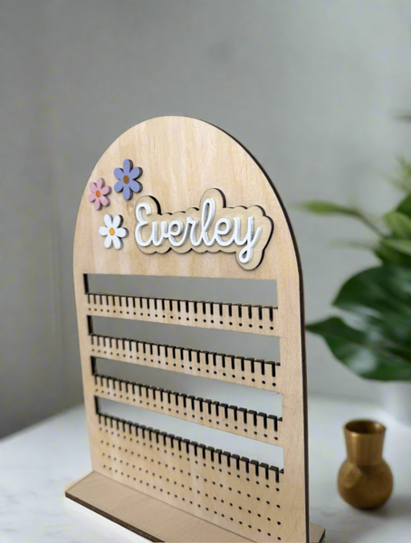 A wooden personalized earring stand 